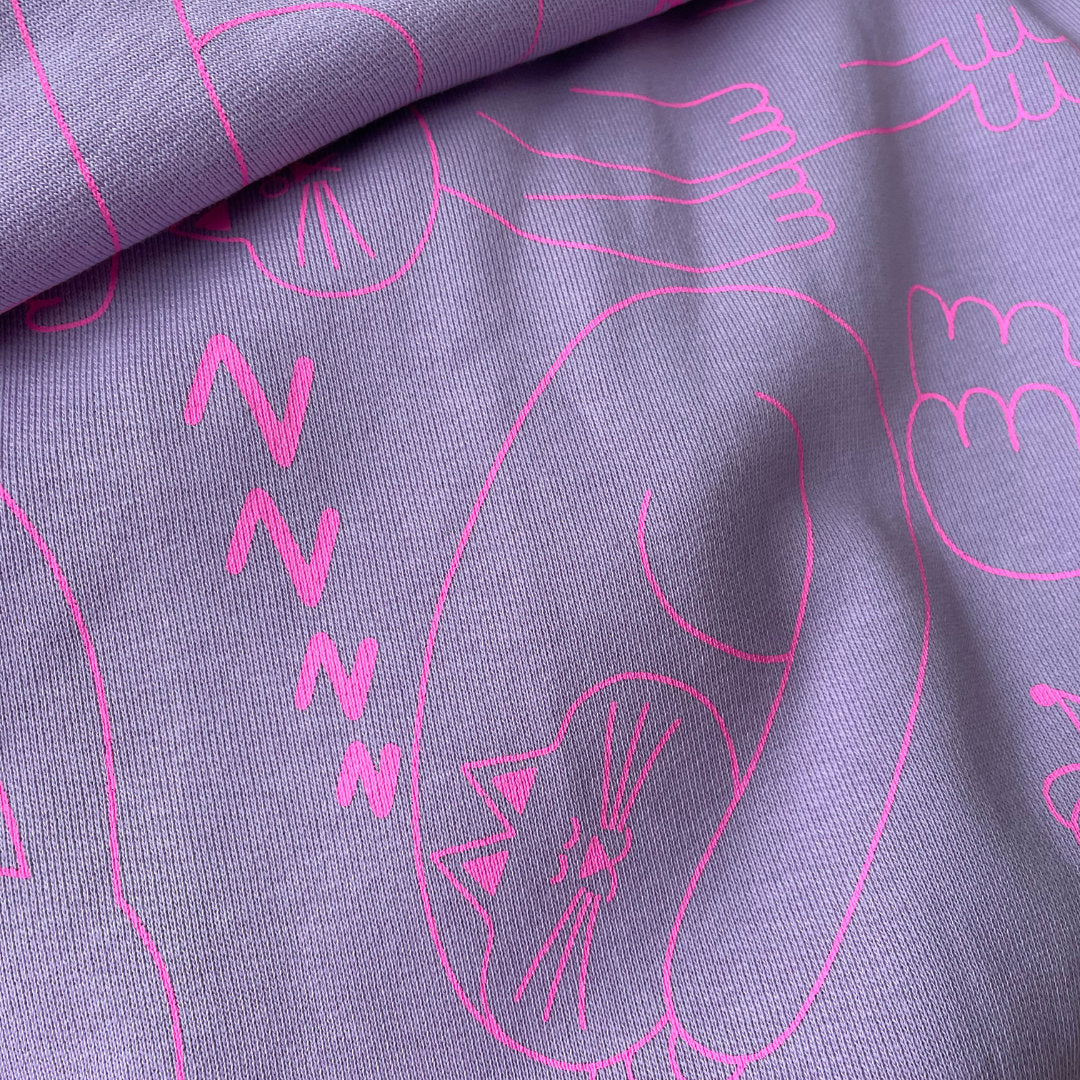 Lilac and hot pink hand screen printed tracksuits by indie brand YUK FUN