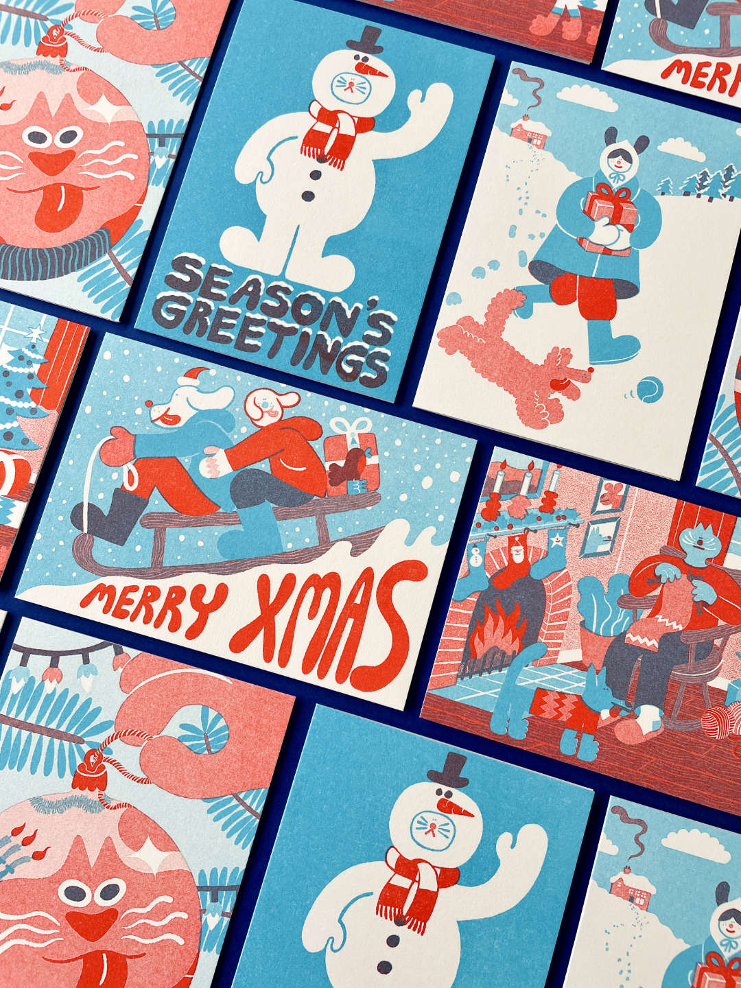 Collection of Christmas-themed cards with snowmen, Santa Claus, and winter scenes illustrated by YUK FUN