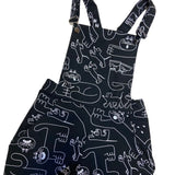 YUK FUN Dora organic cotton dungarees in black and white