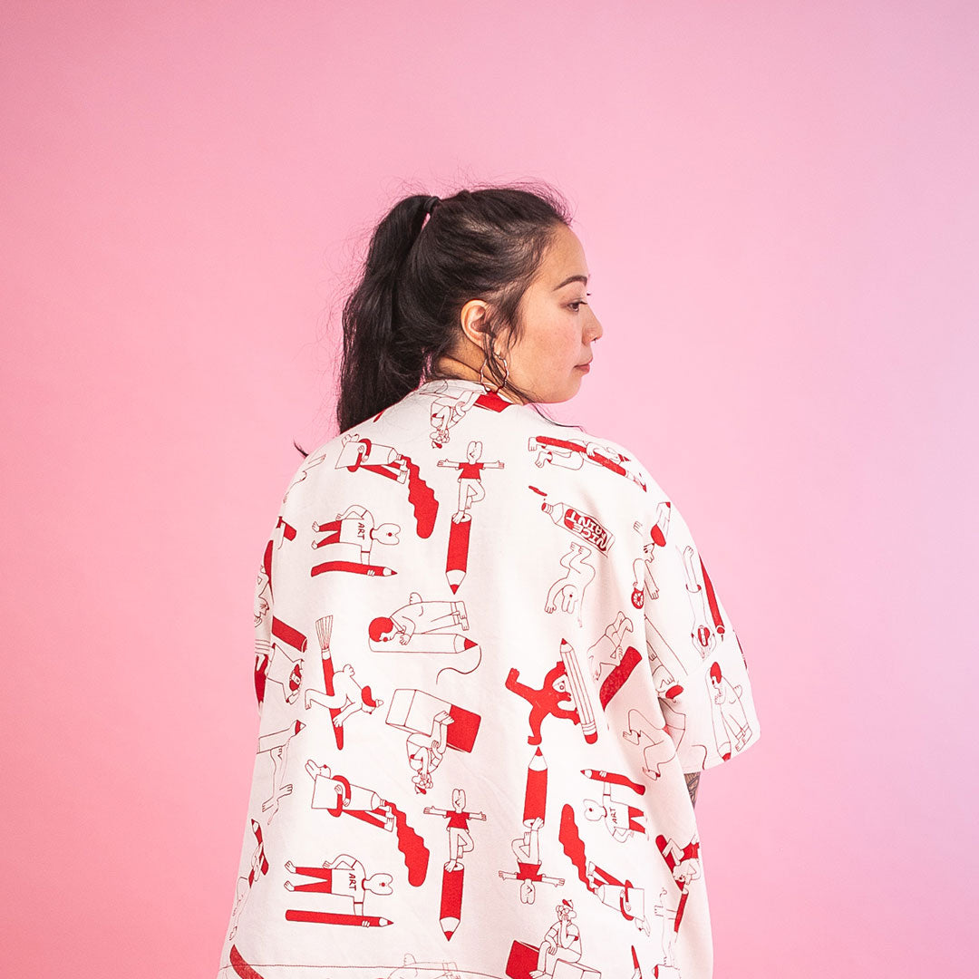 Red Artist Suit jacket from the back, hand screen printed with all over pattern of creative characters by YUK FUN