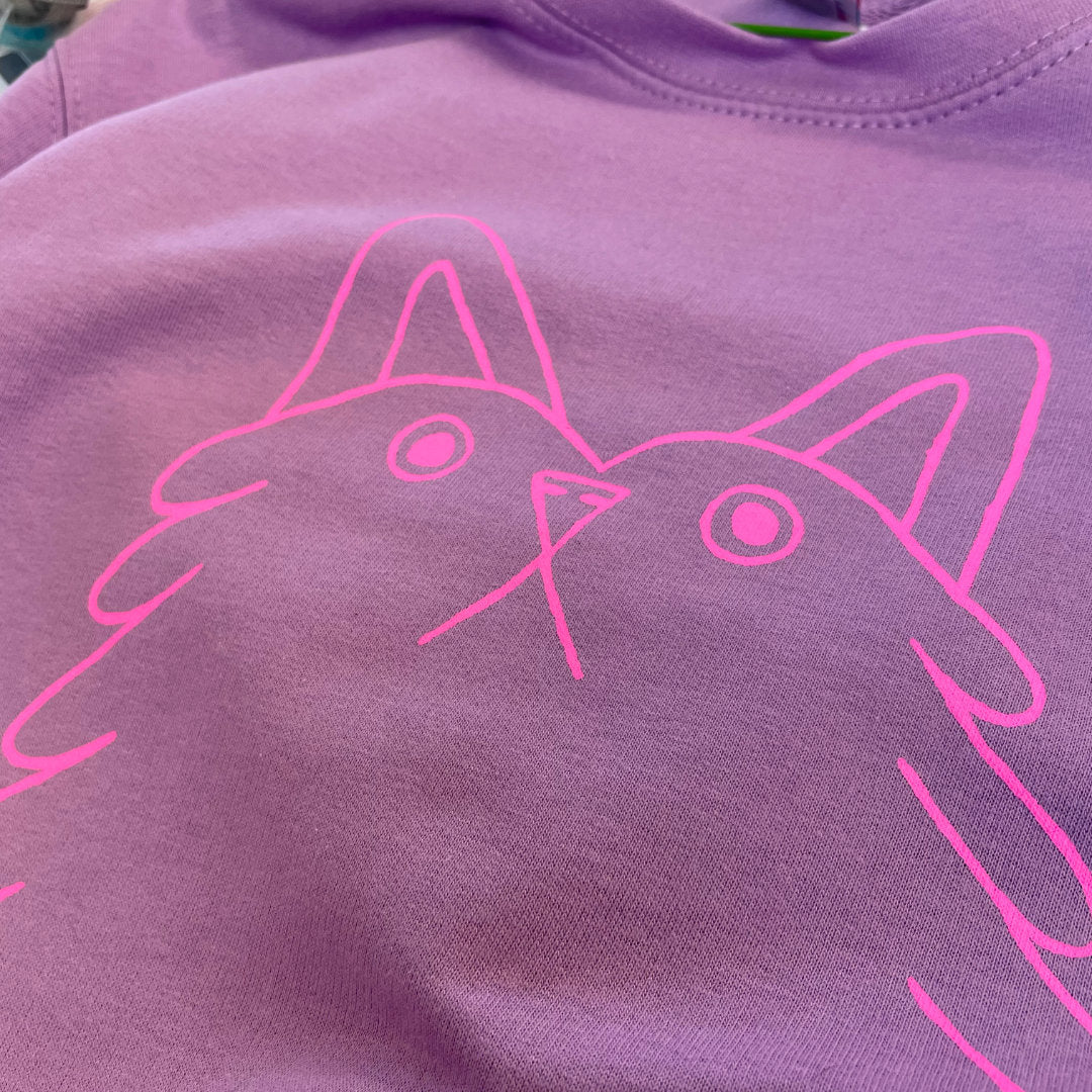 Close up detail of the neon pink and lilac YUK FUN sweatshirt