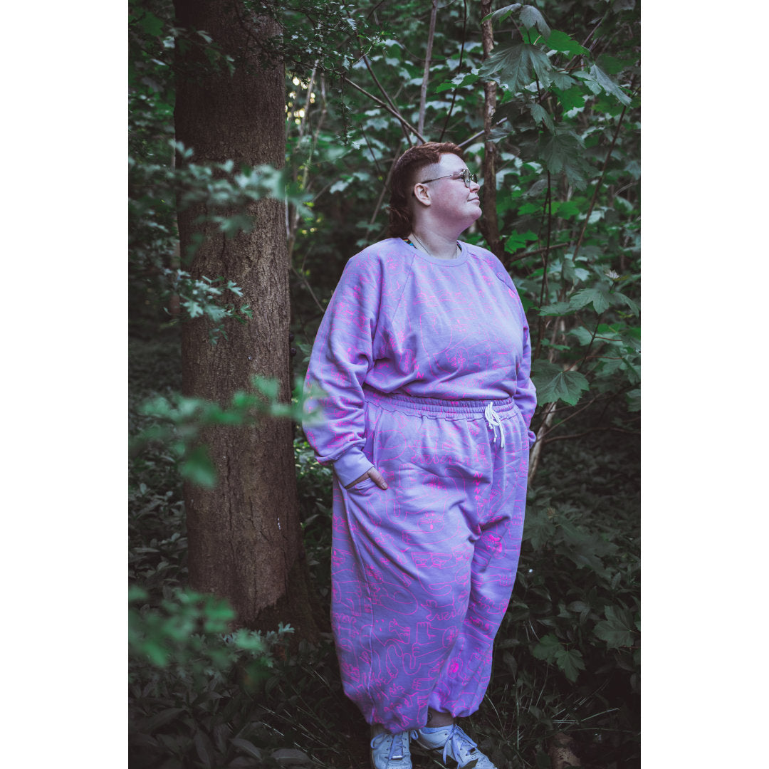 Size inclusive organic cotton lilac tracksuits made in the UK by illustration duo YUK FUN