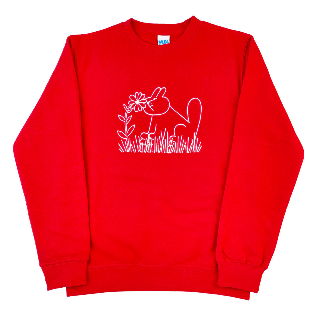 Organic red sweatshirt with screen printed bunny dog sniffing flowers design by YUK FUN